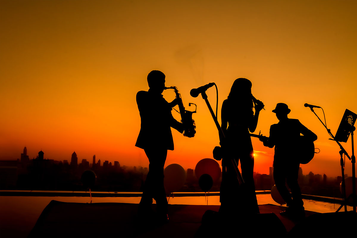 jazz folk band silhouette sunset background